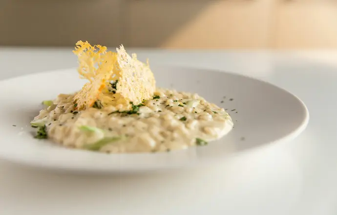 a white plate topped with food on top of a table